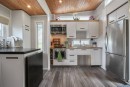 The SerendipTiny home is based on the Aurora model, with two massive slide-outs nearly doubling living space at camp