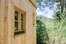 The Wohnwagon is a tiny home that looks like a log cabin and can be self-sufficient if you want it to