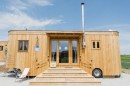 The Wohnwagon is a tiny home that looks like a log cabin and can be self-sufficient if you want it to
