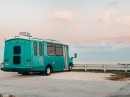 This Chevy G4500 shuttle bus became a tiny beach house on wheels