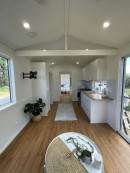 This park model tiny house brings a very airy and cozy design with no compromise on comfort or functionality
