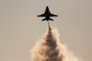 Thunderbirds F-16 in ascension in smoke maneuver