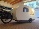 The Velocamper is a mini-RV designed for an electric bicycle, with quite a surprisingly elegant interior
