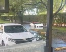 Driver is trying to save his Lamborghini Huracan from the flood
