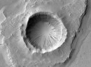 Martian impact crater looking like the mouth of Shai-Hulud