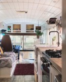Mobile home is a skoolie conversion with a tiny house loft on top, offers sleeping for 7 and 2 pets