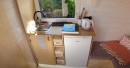 DIY tiny house is very compact, still sleeps 3 people and has a sauna