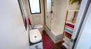 Tiny House with a Downstairs Bedroom, a Large Deck, and a Full Bath