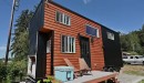 Tiny house with two lofts and a deck mainly built by a young woman and her dad