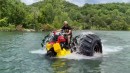 Honda three-wheeler gets 66-inch monster truck tires for lake crossing on WhistlinDiesel