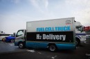Gaseous hydrogen-powered cars require large delivery trucks for the storage tanks