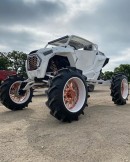 Polaris RZR Turbo on forward arched A arms and 8-inch portals riding on Forgiato wheels