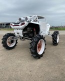 Polaris RZR Turbo on forward arched A arms and 8-inch portals riding on Forgiato wheels