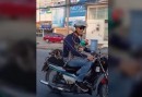 Cats riding on a motorcycle