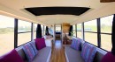 This purple school bus has been converted into a mobile home with two bedrooms