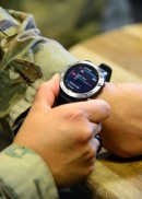 Tech. Sgt. Carmen Turcios Munoz, Ellington Airman Leadership School instructor, shows off a smart watch which provides Airmen biofeedback