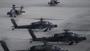 Black Hawk and Apache helicopters in action