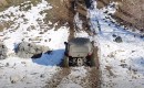 Vanderhall Brawley playing in the mud and snow