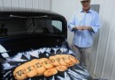 Vanilla Ice and the car that has his portrait airbrushed on the tailgate