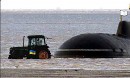 Ukrainian Farmer tractor towing submarine