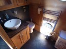 Walhalla is a custom narrowboat that looks menacing but come with an incredibly cozy interior