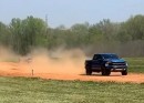 Watch a Ford F-150 Raptor owner breaking his back with a huge jump