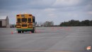 Watch a school bus take the moose test, handles it like a pro