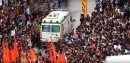 Ambulance cutting through crowd in India