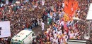 Ambulance cutting through crowd in India
