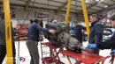 Extracting the engine from a Lamborghini Countach QV requires a really tall hoist