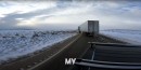 A Rivian R1T Pulling a Semi-truck Back onto the Road