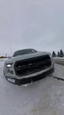 Rivian R1T rescues Ford F-150 Raptor from the snow