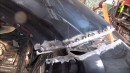 Watch This Russian Mechanic Fix a BMW 7 Series by Welding on a New Back End