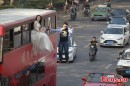 Wedded Couple Levitating off the Side of a Double-Decker Steals the Show in China