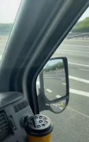 Motorist Notices Grass Snake on Van's Mirror