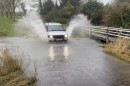 Drivers fight the aftermath of strom Henk driving nose-first into flooded sectors of the roads