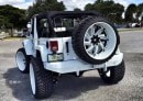 White Jeep Wrangler with Forgiatos and 37-Inch Mud Tires