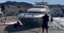 Motor yacht Why is pushed by wind onto beach and into a stone pier