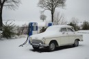 Car at gas station in winter