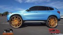 BMW X1 riding on Brushed Gold Rucci Forged 30-inch wheels on Superior Shelbie & Ace Whips