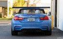 Yas Marina Blue BMW M4 with Trunk Wing