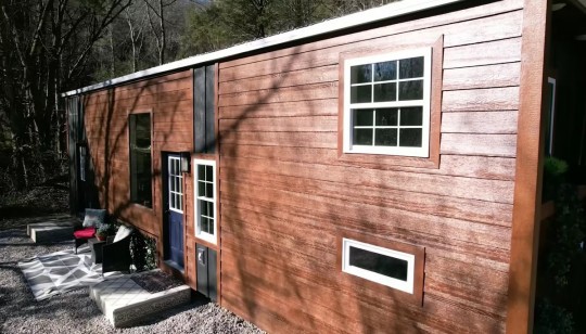 This Tiny House Has Unique Kitchen Countertops With LEDs, an Arched Roof, and a Man Cave