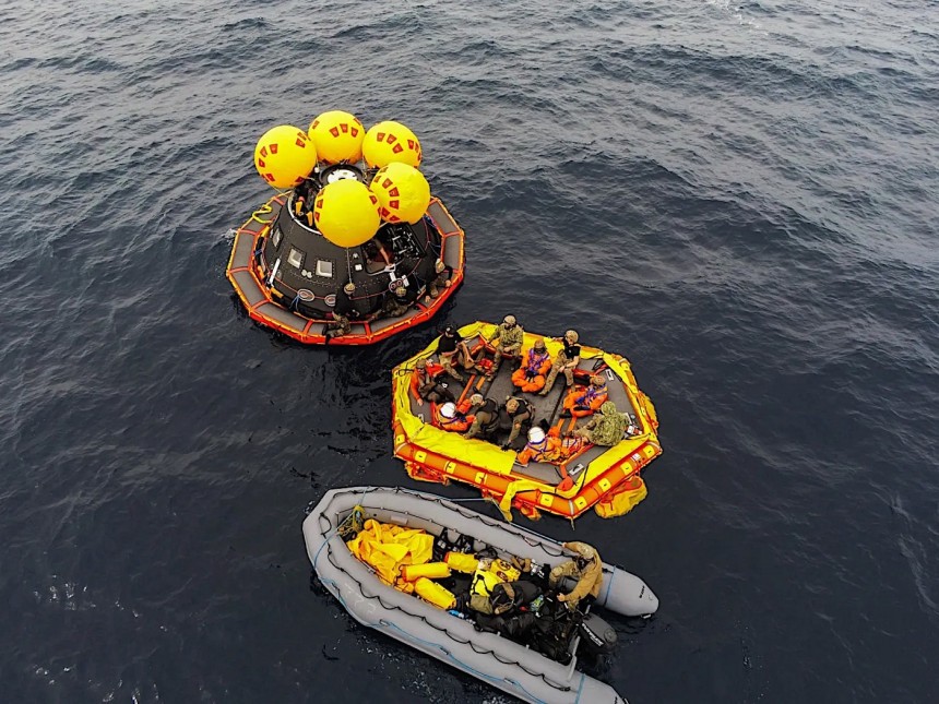 NASA and Navy people practicing Orion spacecraft recovery