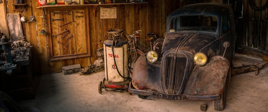Rusty car in storage space