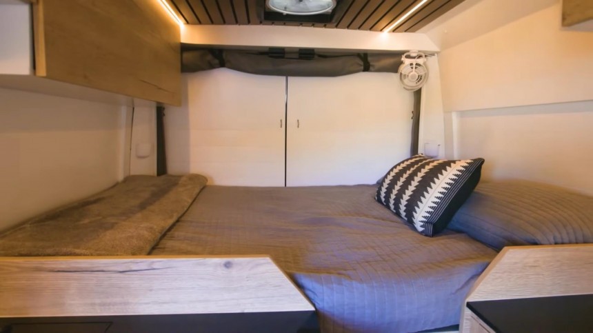 Cozy, Carpenter\-Built Camper Van Boasts a Unique U\-Shaped Kitchen and a Hidden Shower
