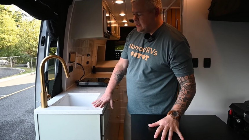 Custom Camper Van Is Loaded With Creatures Comforts, Including a Fold\-Up Double Seat