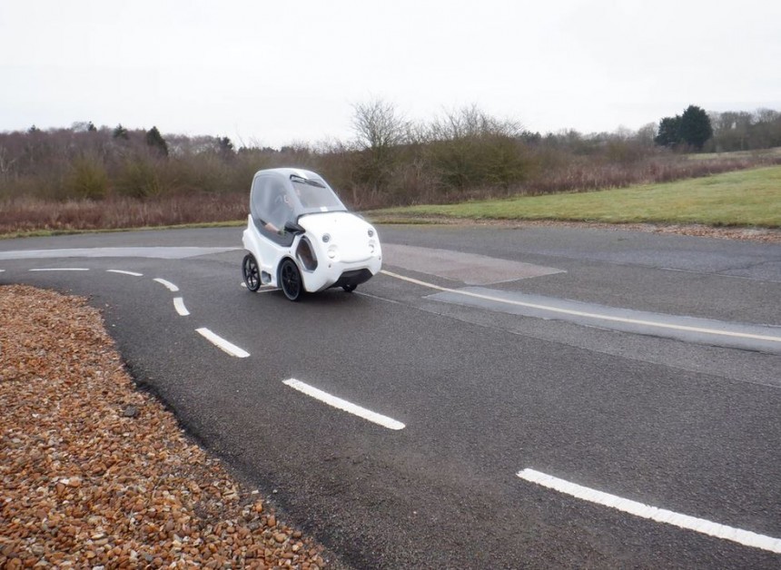 This is DryCycle, a four\-wheel, fully enclosed e\-bike that offers some of the functionality of a car
