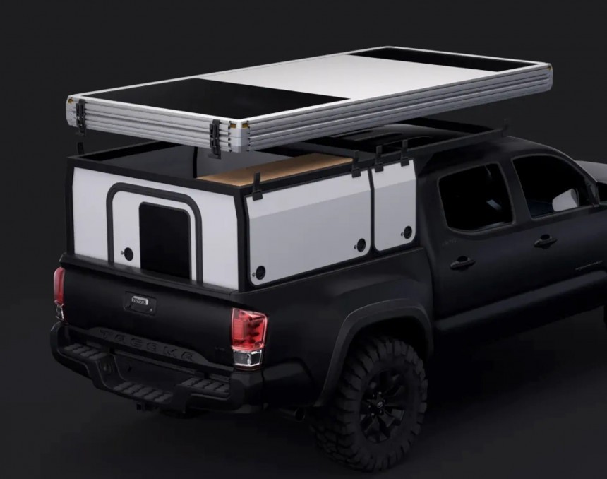 Hardsider pop\-up pickup camper with innovative hard walls that fold
