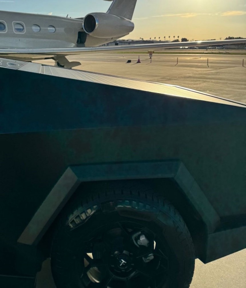 Kim Kardashian shows off her new Tesla Cybertruck, parked by her private jet