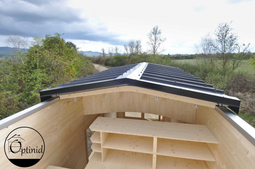 The Marie\-Ange tiny house from Optinid is very rustic\-looking, has trademark sliding roof